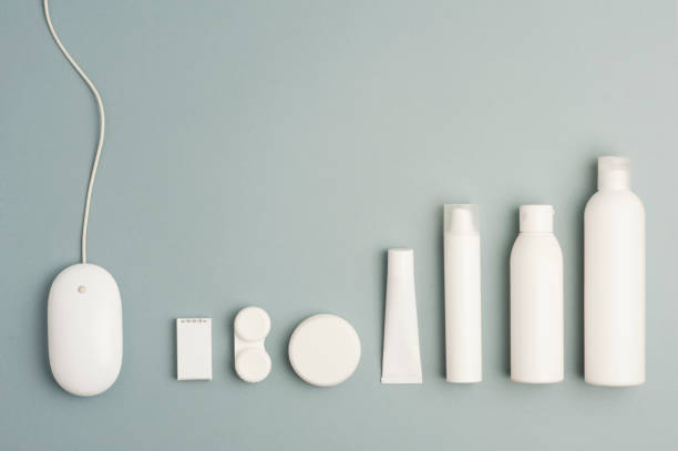istock Collection of various beauty hygiene containers on soft gray background. Wired computer mouse, space to fill.top view 1206482789