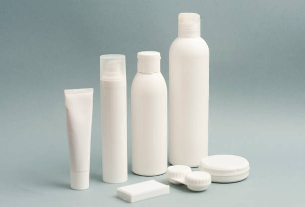 istock Collection of various beauty hygiene containers on soft gray background. Wired computer mouse, space to fill. 1206482806