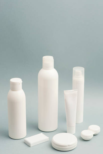 istock Collection of various beauty hygiene containers on soft gray background. Wired computer mouse, space to fill. 1206482844
