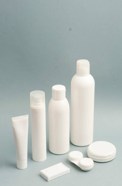 istock Collection of various beauty hygiene containers on soft gray background. Wired computer mouse, space to fill. 1206482874