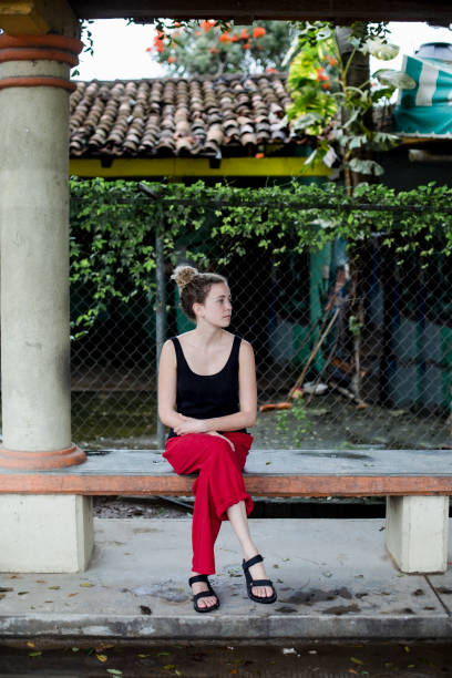 istock Beautiful young women waiting for the bus 1206484241