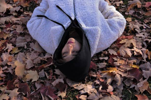 istock Woman relaxing, lying on the ground 1206484383