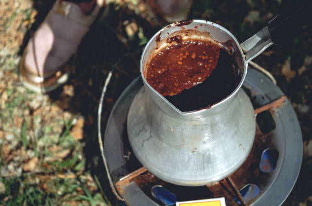istock Girl preparing coffee in the woods 1206485523