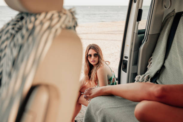 istock Two young women inside de van near the beach 1206485846