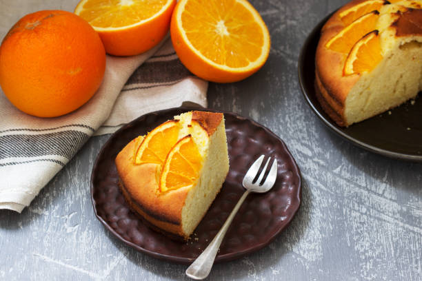 istock Orange cake with slices of orange on a concrete background. 1206488643