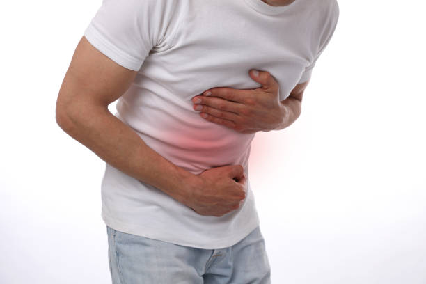 istock Man with stomach pain. Digestive system poblems, Food poisoning 1206492710