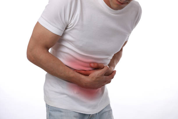 istock Man with stomach pain. Digestive system, Urinary Tract Infection problems. 1206492746