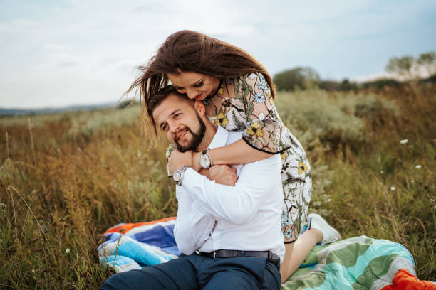istock Loving couple enjoying picnic in nature 1206493370