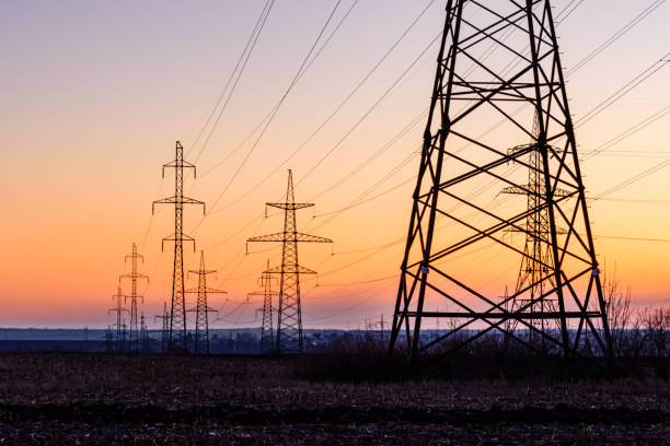 istock High voltage power line in a field at sunset 1206493512