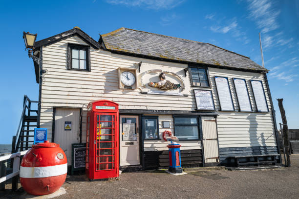 Broadstairs, England - Feb 12 2020 The old life boat station with a red traditional telephone box and buoy outside.