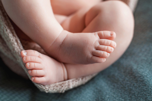 Baby toes on a blanket