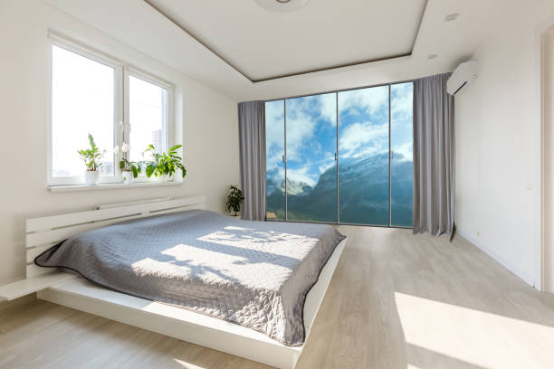 istock Comfortable big bed in interior of room 1206497956