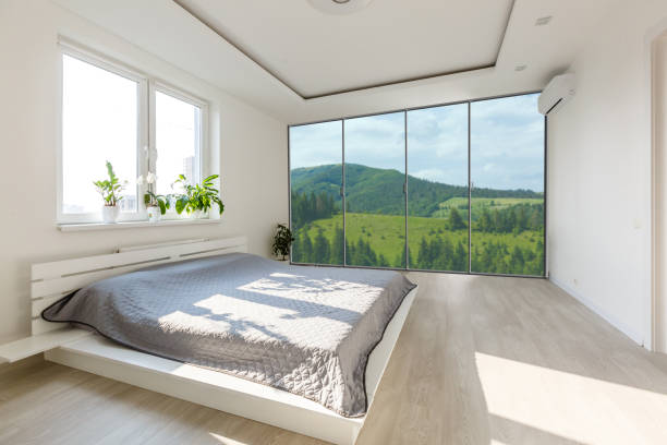 istock Comfortable big bed in interior of room 1206497994