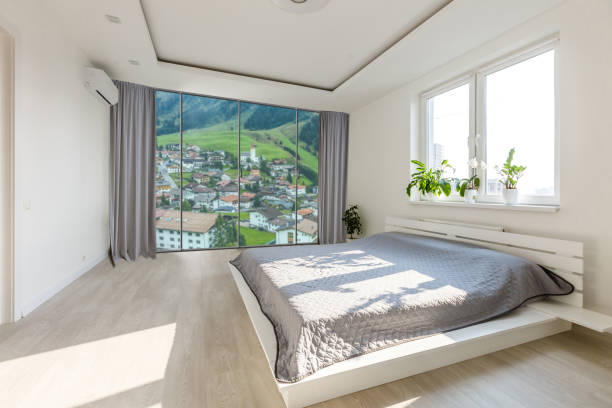 istock Comfortable big bed in interior of room 1206498068