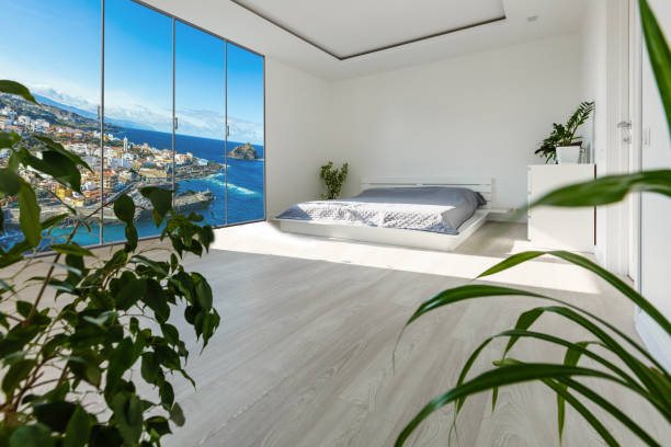 istock panoramic view of nice cozy bedroom with summer outdoor. 1206498252