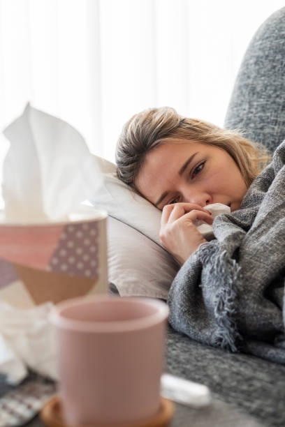 istock Sick woman with flu at home 1206504322