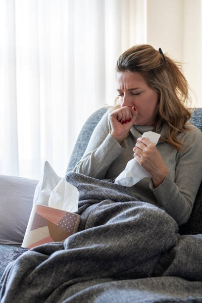 istock Sick woman with flu at home 1206504366