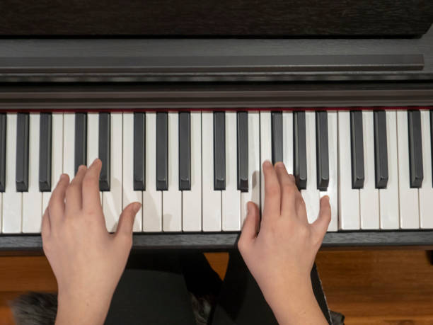istock a young lady plays the piano 1206505237