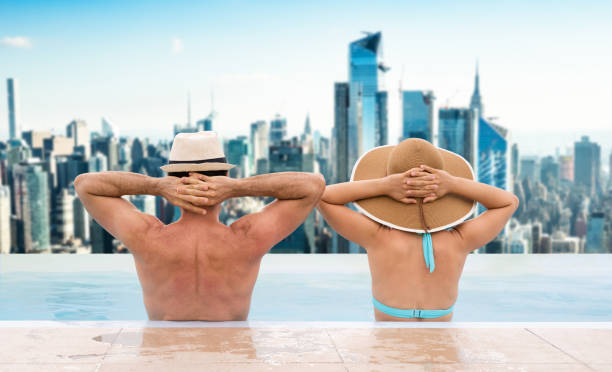 istock Couple In Infinite Swimming Pool In Dubai 1206509667
