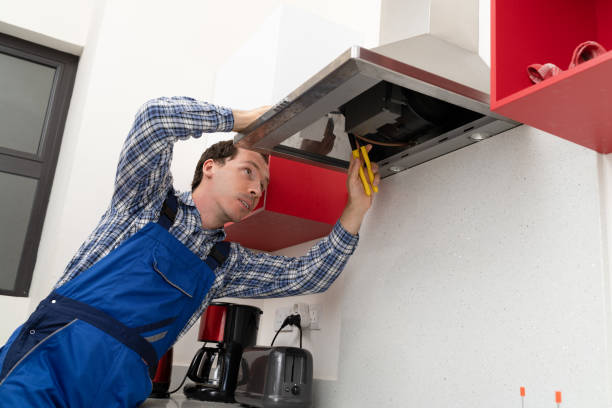 istock Electrician Repairing Kitchen Extractor 1206509762