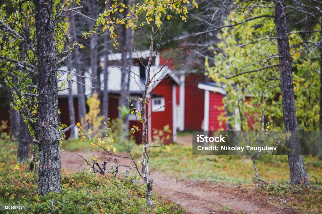 View of Classical swedish Camping site with traditional wooden red cabin cottage houses, Lapland, Northern Sweden View of Classical swedish Camping site with traditional wooden red cabin cottage houses, Lapland, Northern Sweden"n Log Cabin Stock Photo