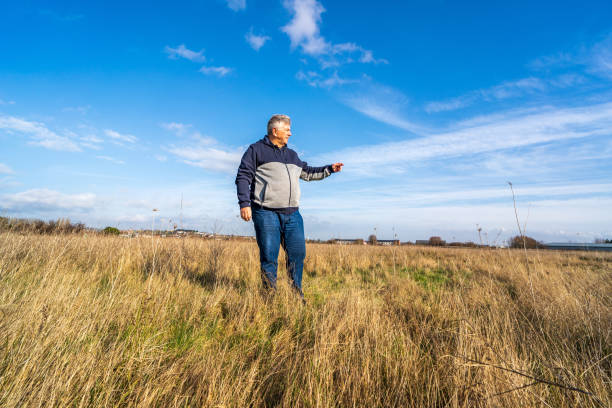istock Senior man walking on grassland 1206519008