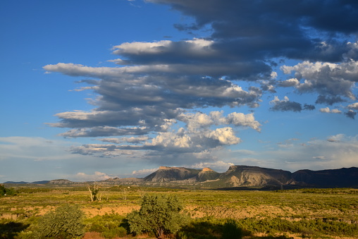 Viewed from outside the park, dynamic clouds move over Mesa Verde National Park, Colorado.
