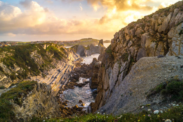 istock Sunset with sun, clouds and calm sea on cliffs of Costa Quebrada 1206525439