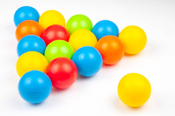 istock Colored plastic balls on white background. leisure and game items. round objects 1206530935