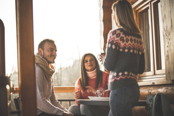 istock Friends enjoying warm winter day outdoors with some tea 1206532105