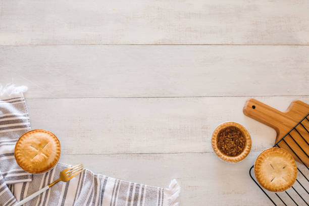 Flat lay composition with mini pies and copy space