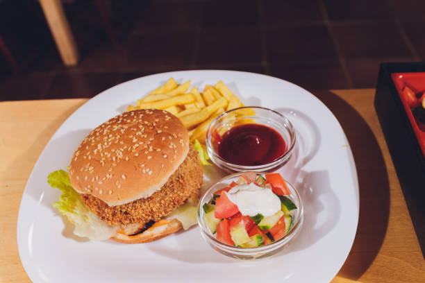 istock Mini Burger platter with fries Salad on the table. 1206532865