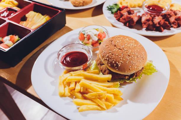 istock Mini Burger platter with fries Salad on the table. 1206532898