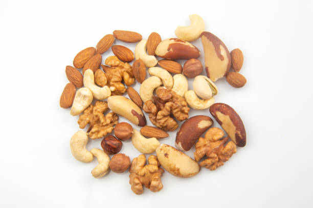 istock different nuts on a white background. protein and healthy food 1206533712