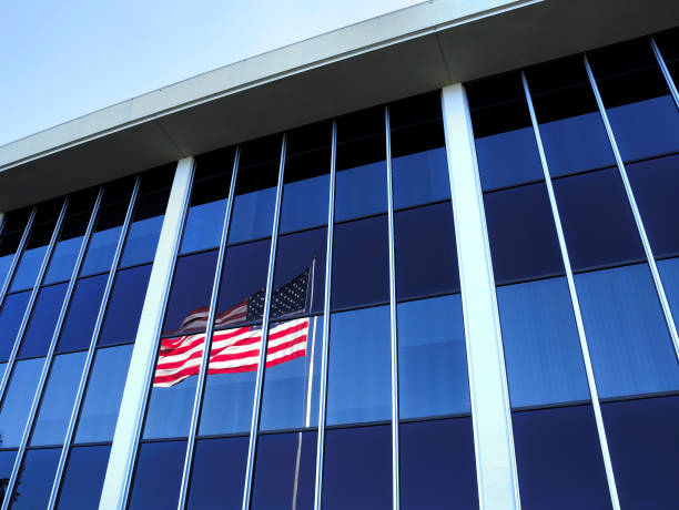 istock American Flag Reflected in Windows of County Courthouse 1206534381