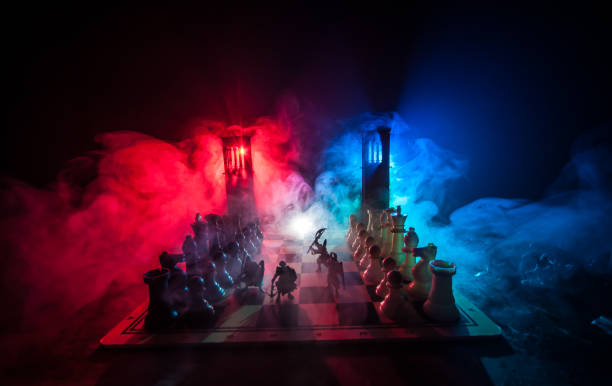 istock Chess figures on a dark background with smoke and fog. Selective focus 1206535495