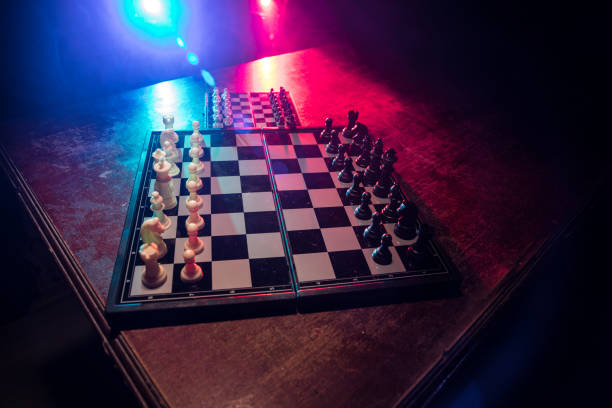 istock Chess figures on a dark background with smoke and fog. Selective focus 1206535561
