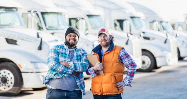 truck drivers with fleet of semi-trucks - truck driver truck trucking semi truck imagens e fotografias de stock