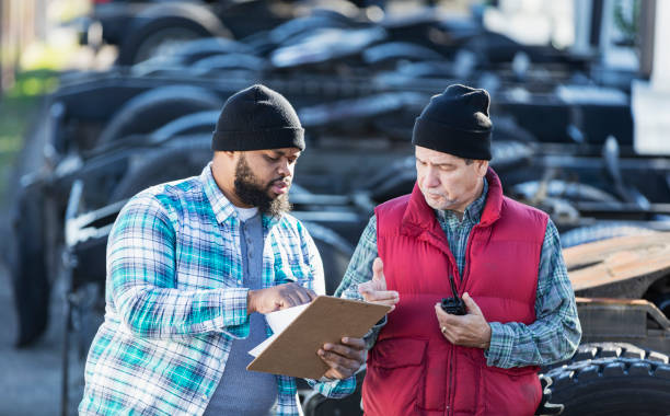 istock Workers at trucking company 1206537043