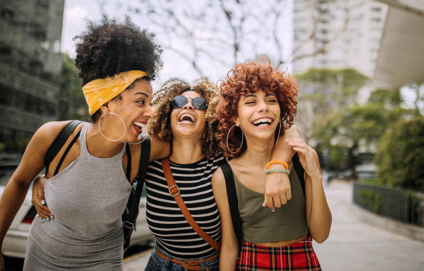 istock Three girlfriends having fun in the city 1206537119
