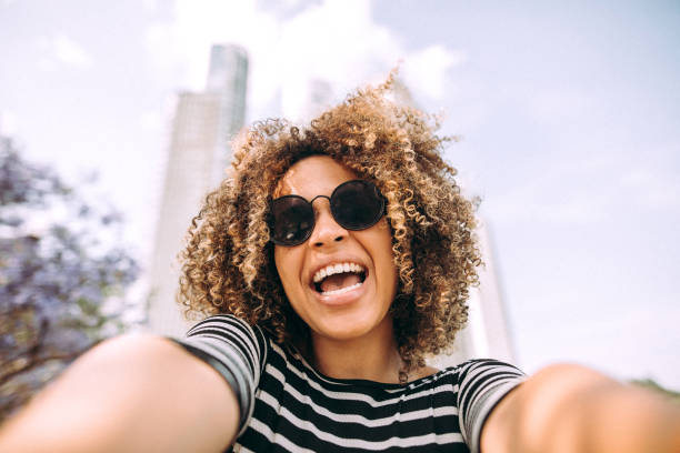 istock Cute Hispanic Girl Taking a Selfie 1206538477