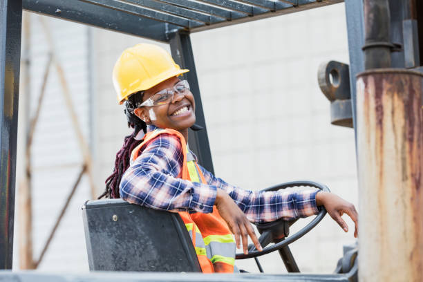 istock African-American woman operating forklift 1206538480