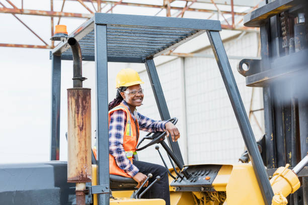 istock African-American woman operating forklift 1206538511