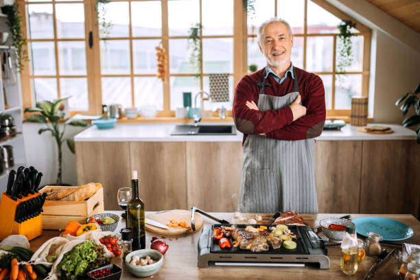 istock Portrait of a confident senior man in the kitchen 1206539664