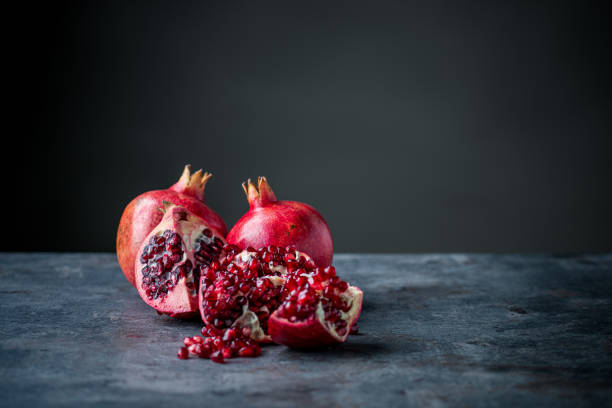 istock Ripe pomegranate. Pomegranate on black background. Dessert,food. 1206540719