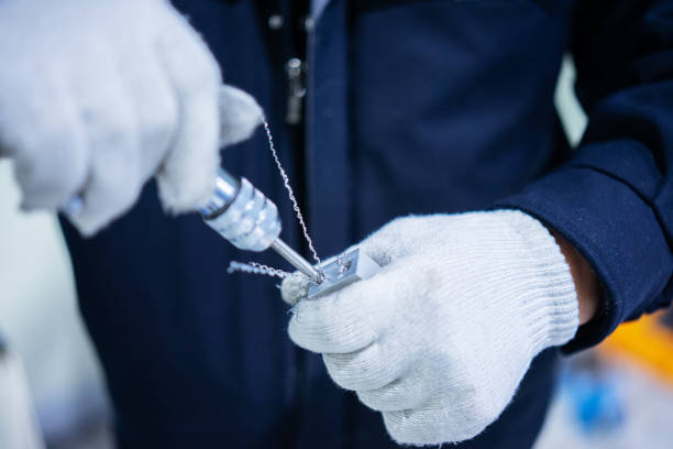 istock drilling a metal parts with a hand drill 1206547991