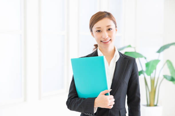 istock asian woman with files 1206556361