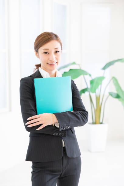 istock asian woman with files 1206556972