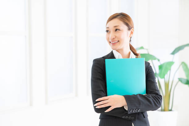 istock asian woman with files 1206556987