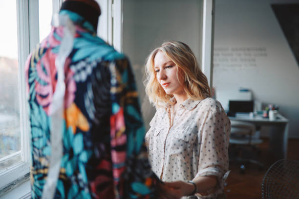 istock Female designer looking at a new dress 1206558976
